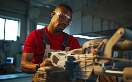 A man working with manufacturing equipment